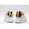 AMQ OVERSIZED SNEAKER with gold grain leather heel