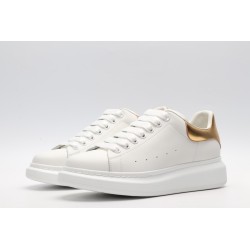 AMQ OVERSIZED SNEAKER with gold grain leather heel