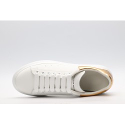 AMQ OVERSIZED SNEAKER with gold grain leather heel