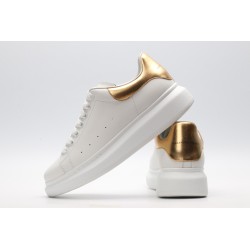 AMQ OVERSIZED SNEAKER with gold grain leather heel