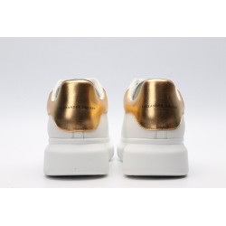 AMQ OVERSIZED SNEAKER with gold grain leather heel