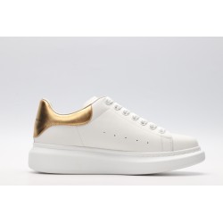 AMQ OVERSIZED SNEAKER with gold grain leather heel