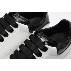 AMQ OVERSIZED SNEAKER with blue stamped python heel