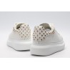 AMQ OVERSIZED SNEAKER with gold-finished hammered stud