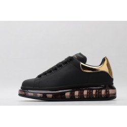 AMQ oversized sneakers black with gold heel