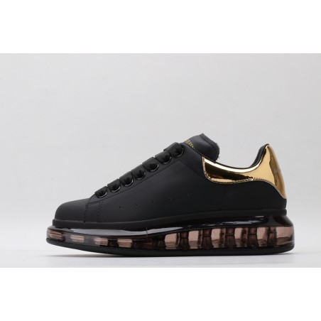 AMQ oversized sneakers black with gold heel