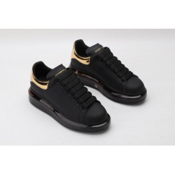 AMQ oversized sneakers black with gold heel