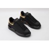 AMQ oversized sneakers black with gold heel