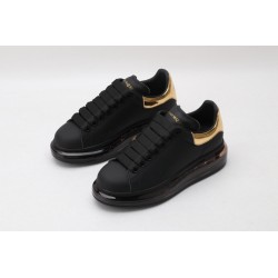 AMQ oversized sneakers black with gold heel