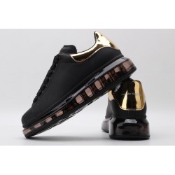 AMQ oversized sneakers black with gold heel