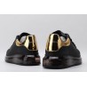 AMQ oversized sneakers black with gold heel