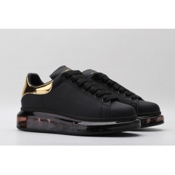 AMQ oversized sneakers black with gold heel