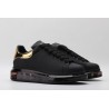 AMQ oversized sneakers black with gold heel