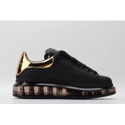 AMQ oversized sneakers black with gold heel