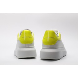 AMQ yellow foil embellished chunky leather sneakers