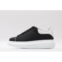 AMQ oversized black sneakers with white heel