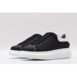 AMQ oversized black sneakers with white heel