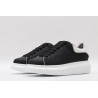 AMQ oversized black sneakers with white heel