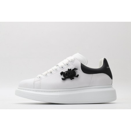 AMQ white oversized sneakers with black heel