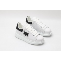 AMQ white oversized sneakers with black heel