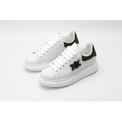 AMQ white oversized sneakers with black heel