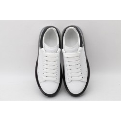 AMQ white oversized sneakers with black heel