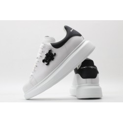 AMQ white oversized sneakers with black heel