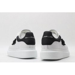 AMQ white oversized sneakers with black heel