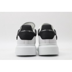 AMQ white oversized sneakers with black heel