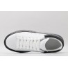 AMQ white oversized sneakers with black heel