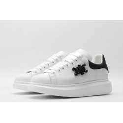 AMQ white oversized sneakers with black heel