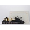 AMQ black oversized sneakers with gold heel