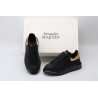 AMQ black oversized sneakers with gold heel