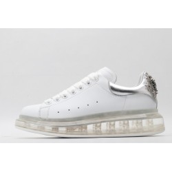 AMQ white oversized sneakers with siL*Ver heel