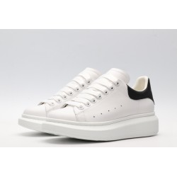 AMQ white oversized sneakers with black heel