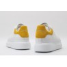 AMQ oversized sneakers with yellow heel