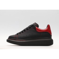 AMQ black oversized sneakers with red heel