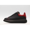 AMQ black oversized sneakers with red heel