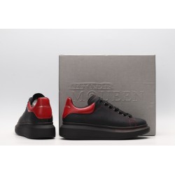 AMQ black oversized sneakers with red heel