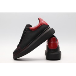 AMQ black oversized sneakers with red heel