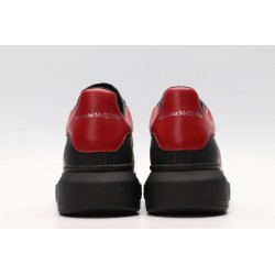 AMQ black oversized sneakers with red heel