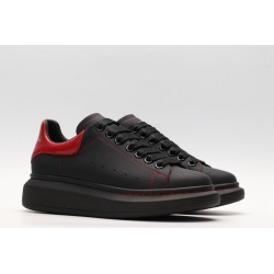 AMQ black oversized sneakers with red heel