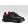 AMQ black oversized sneakers with red heel