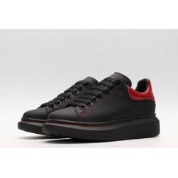 AMQ black oversized sneakers with red heel