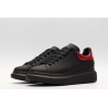 AMQ black oversized sneakers with red heel