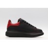 AMQ black oversized sneakers with red heel