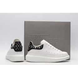 White calf leather lace-up sneaker trimmed with contrasting-color black calf leather heel