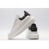 White calf leather lace-up sneaker trimmed with contrasting-color black calf leather heel