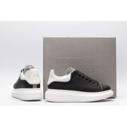 AMQ black oversized sneakers with siL*Ver heel