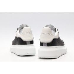 AMQ black oversized sneakers with siL*Ver heel